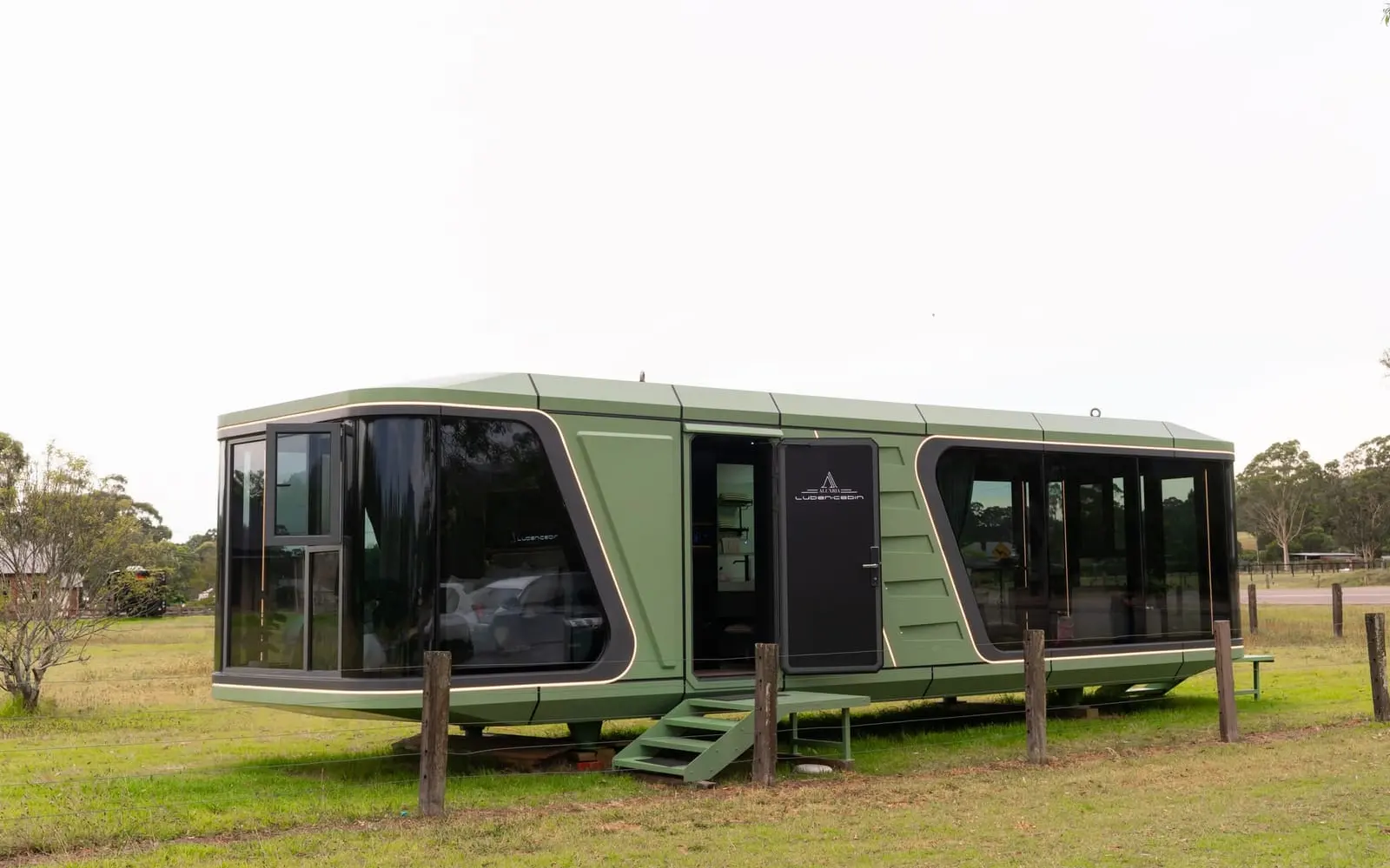 Aluxria capsule in sage green on a grassy site