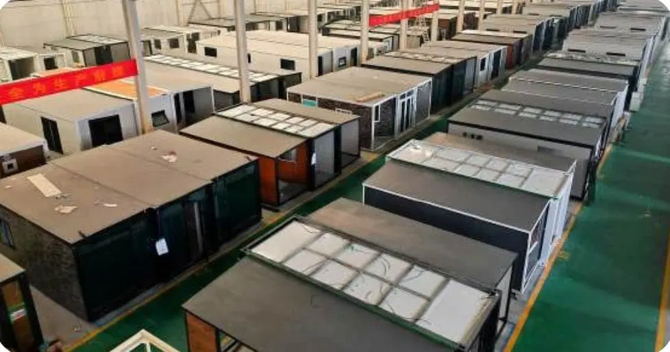 Rows of expandable houses in production on a factory floor