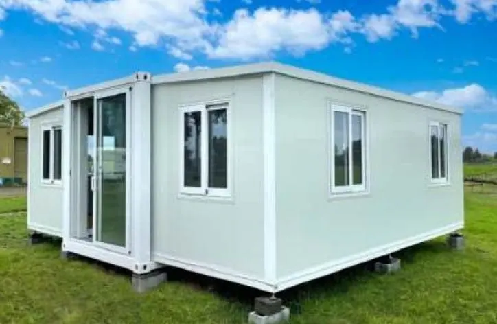 White expandable granny flat on a backyard lawn